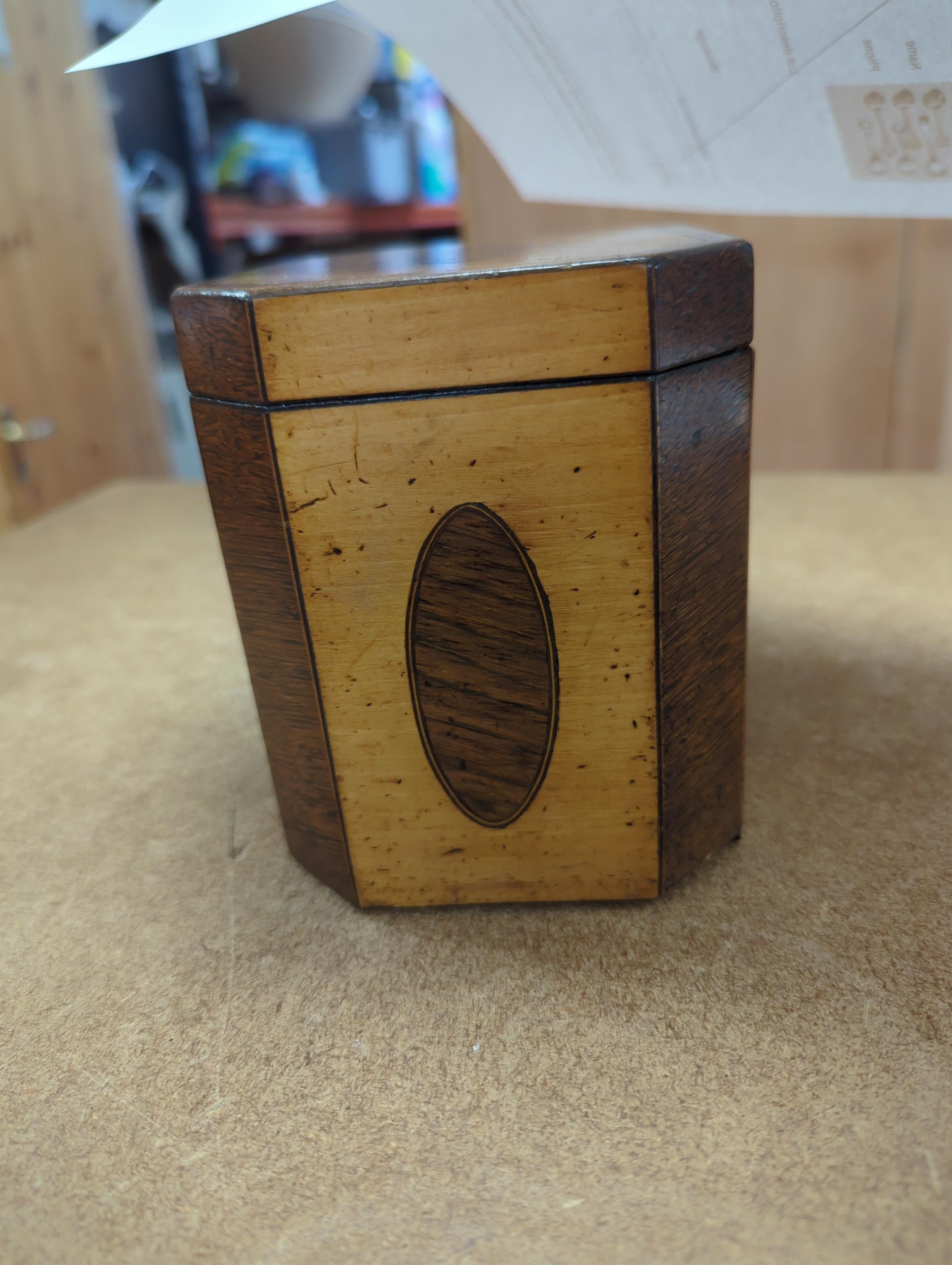 A George III sycamore and rosewood octagonal tea caddy, 13cm